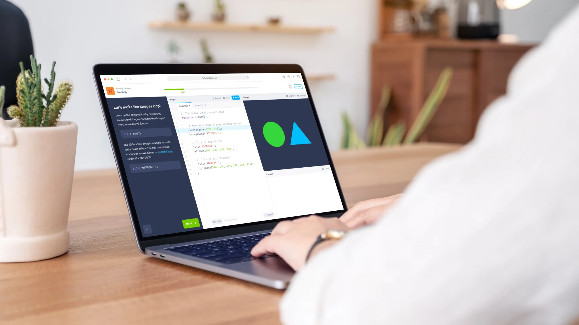 Turinglab's in-browser code editor in use on a laptop